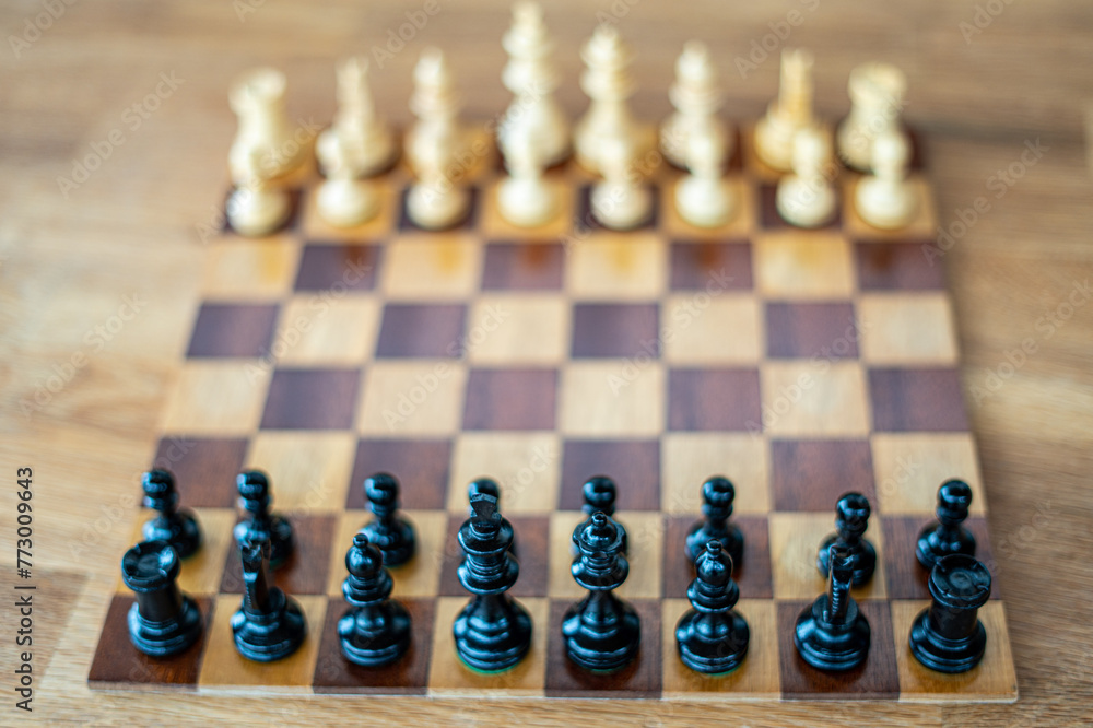 Wooden chess board with black player perspective before start straight angle Wooden chess board with black player perspective before start straight angle