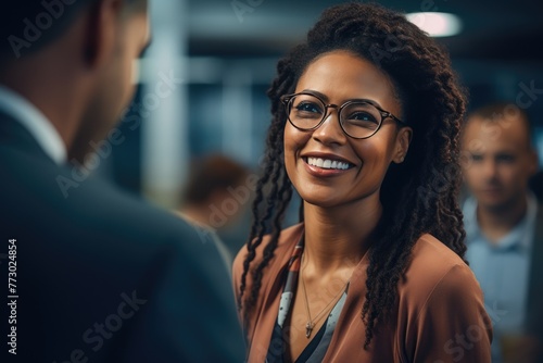 Mature Black Female Executive Engaging Team in Conference