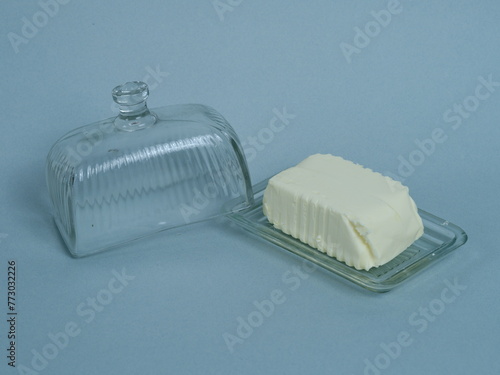 A general plan of some butter on a glass butter dish. March 1, 2024 - Paris, France. © Yann Vernerie