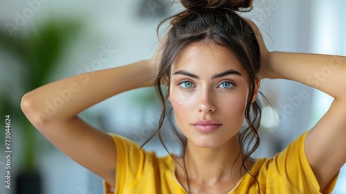 A woman with an untidy topknot hairstyle on her head