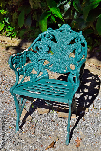 Metallic green chair on garden in Petropolis, Rio de Janeiro, Brazil