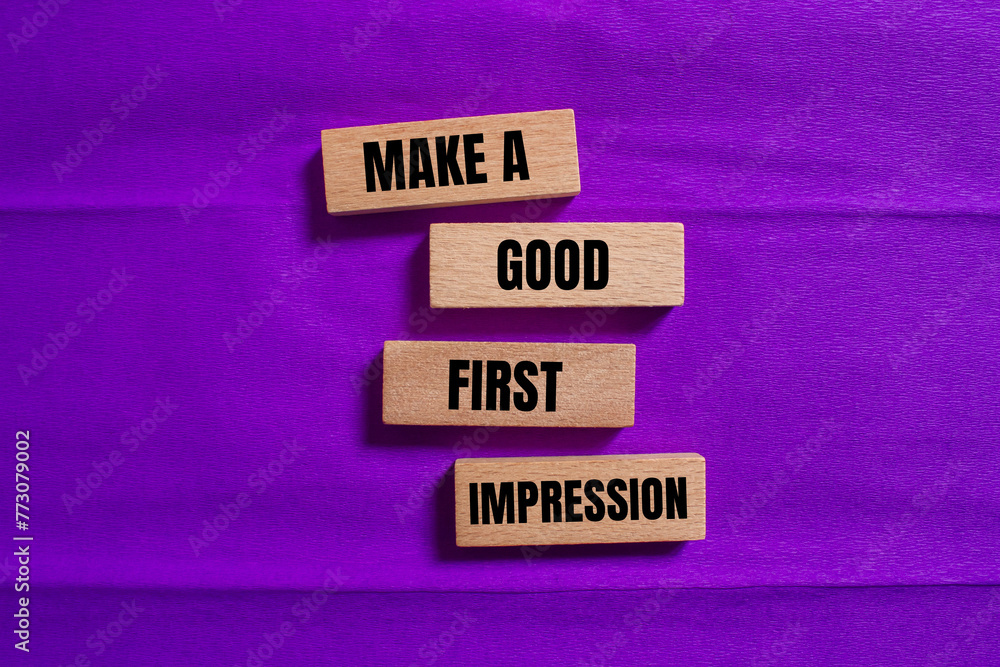 Make a good first impression words written on wooden blocks with purple background. Conceptual symbol. Copy space.