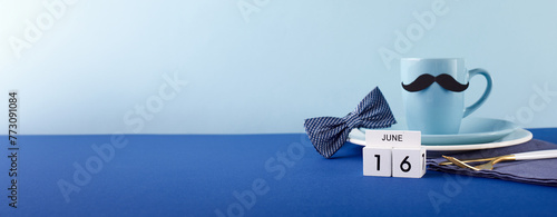 Father's Day Countdown: A wide-angle side view showcasing a Father's Day mug, plate with cutlery and date, with bowtie, set against a bold blue background with ample space for text