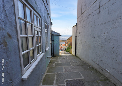Narrow village street with a sea view