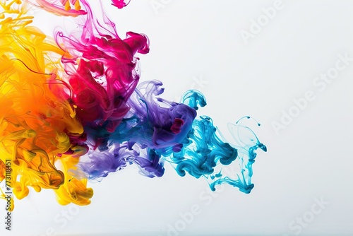 Colorful ink swirls in water on white background
