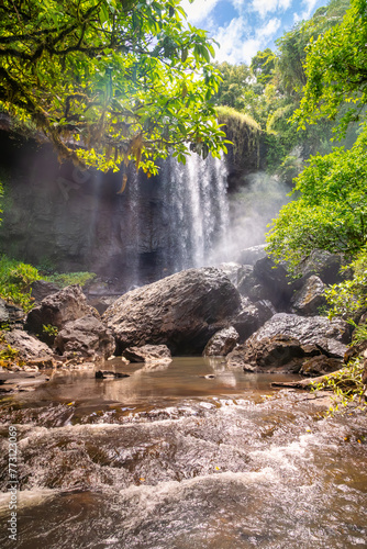 Zillie falls with spray mist as seen from the difficult to reach bottom of the falls which are on the Waterfall Loop at Millaa Millaa on the Atherton Tablelands in Queensland, Australia. photo