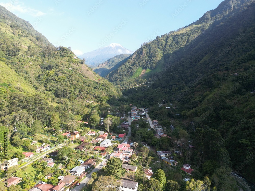 Tranquil village nestled in the valley basking in the warm sunlight. Nevado del Tolima, Colombia.