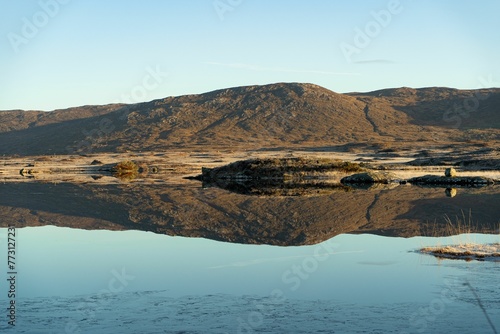 Fototapeta Naklejka Na Ścianę i Meble -  Scenic view of a mountain range reflecting on a lake