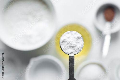 A teaspoon of baking soda or baking powder photo