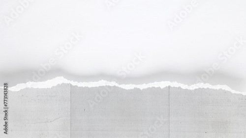A close view revealing the texture and fibers of a torn copier paper edge.