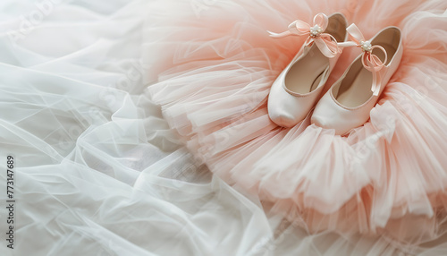 kids pointe shoes and light pink tutu background, ballet dancing clothes.
