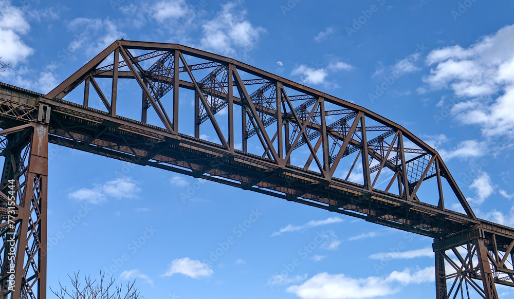 tall railway trestle bridge over the rondout creek in kingston new york (train tracks high up) tall railway trestle bridge over the rondout creek in kingston new york (train tracks high up)