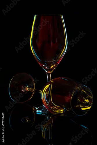 White Wine Glass silhouette over Black Background.