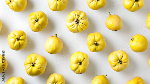 top down view of quinces evenly distributed on white background
