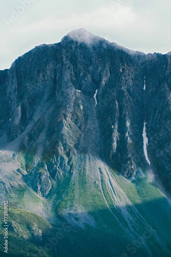 Vertical shot of the Baima snow mountain nature reserve in Diqing, Yunnan province, China. photo