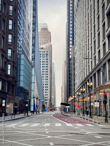 view of a street in downtown Chicago in the Loop district with road traffic and buildings on a cold winter day 