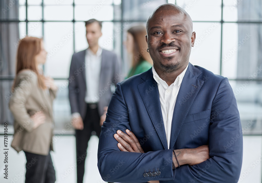 © Katsiaryna - Handsome african american executive businessman in modern office © Katsiaryna - Handsome african american executive businessman in modern office
