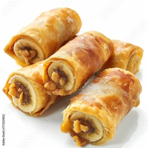 Pisang Molen: Deep-fried banana rolls wrapped in pastry dough, often enjoyed as a snack or dessert with a crispy exterior and soft banana filling