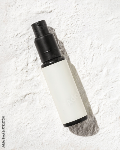 Non Aerosol Dry Shampoo on powder texture background photo