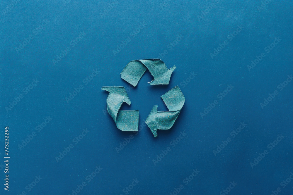 A sophisticated dark blue recycle logo adds depth to a matching blue background, emphasizing ecological care