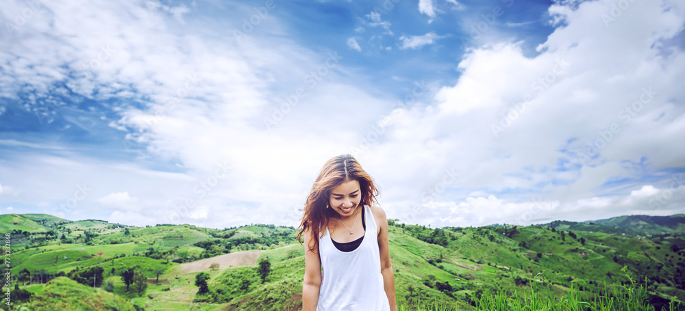 Naklejka premium Asian women travel relax in the holiday. on a green pasture.