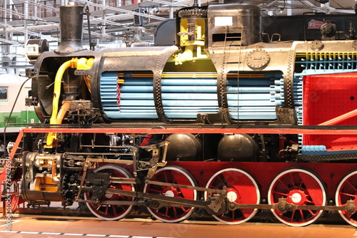 Vintage locomotive retro train. Beautiful locomotive in black and red colors. © Marat