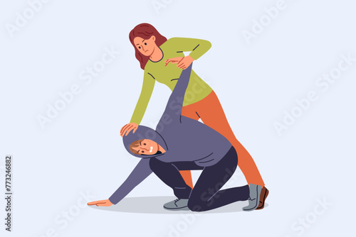 Woman knows self-defense techniques fights back robber, holding criminal until police arrive. Self-defense training for girl wants to have time to stand up for herself during night walks