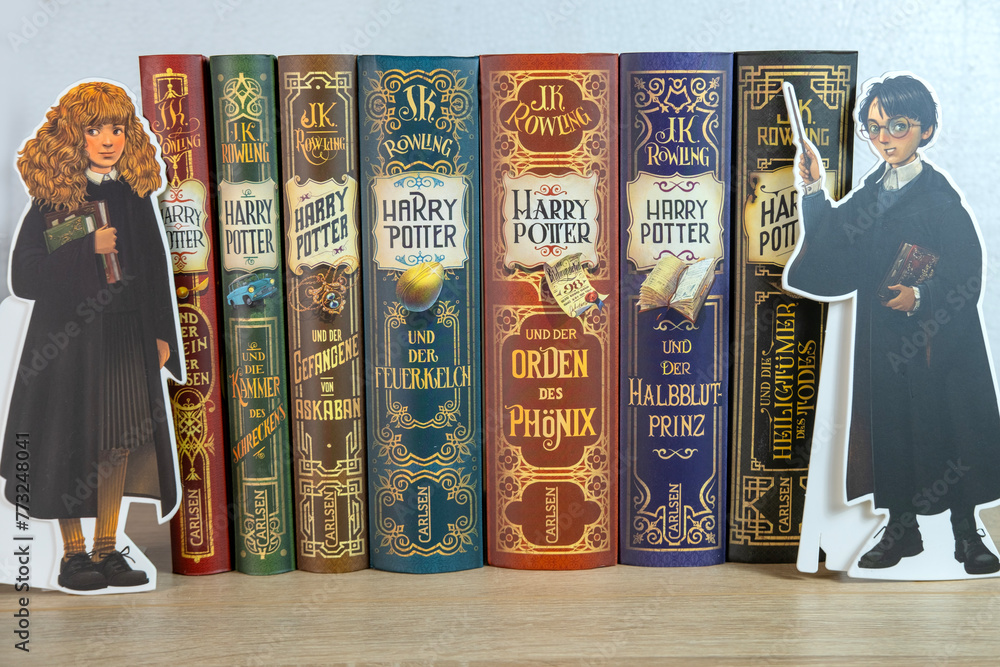 Naklejka premium complete colorful collection paper books by JK Rowling about Harry Potter, appealing to book lovers, especially fans children's literature and fantasy, Frankfurt - December 22, 2023