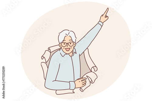 Elderly man peeks out of hole in paper and points finger upwards, paying attention to promo offers