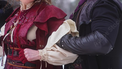A man and a woman in medieval costumes standing next to each other