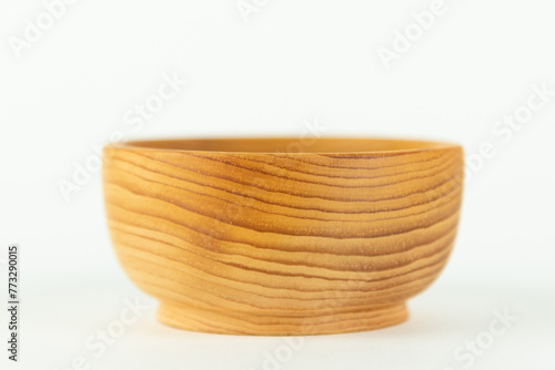 small wooden bowl isolated on white background