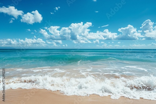 Sandy beach with gentle waves softly rolling onto the shore under a clear blue sky on a peaceful day. © AiHRG Design