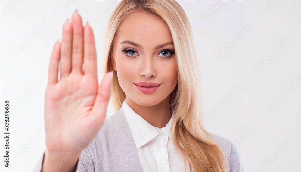 Woman showing stop gesture while standing against white background Woman showing stop gesture while standing against white background