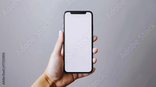 A person is holding a mobile with a white screen