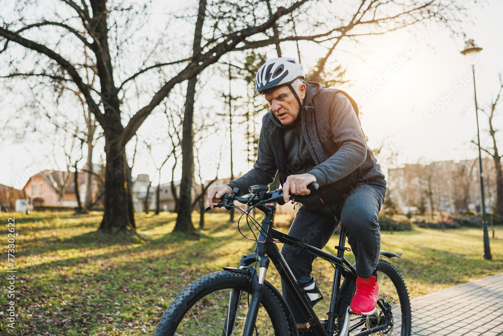 Man Riding Bike in a Park Man Riding Bike in a Park