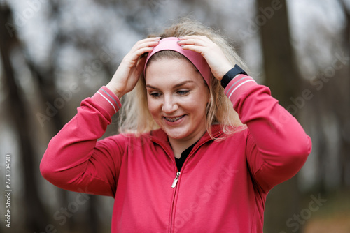 Woman Taking a Break During Outdoor Winter Jog in Park