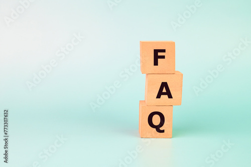 FAQ text on wooden blocks.