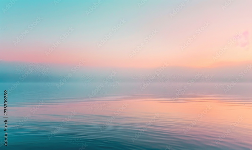 The soft pastel colors of dawn breaking over the horizon