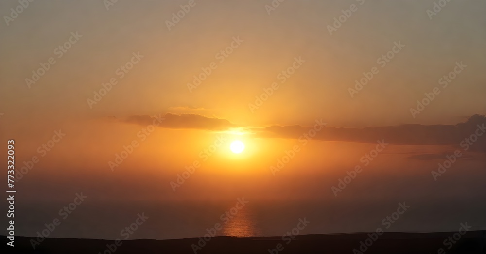 Stunning landscape of a golden sun setting over the horizon of a tranquil blue ocean