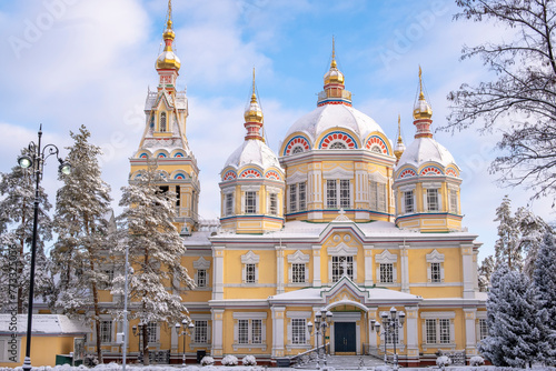 Ascension Cathedral in the Park of 28 Panfilovites in Almaty. Old historical building made of wood in the center of Almaty. Popular tourist place in the snow. photo