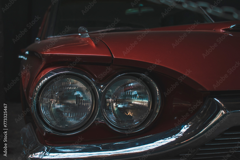 headlights of a red retro car

