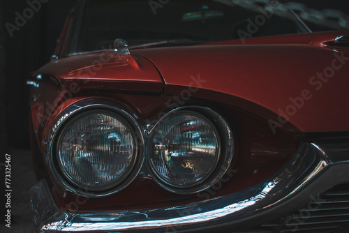 headlights of a red retro car 
