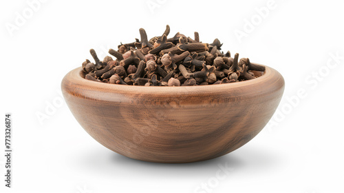 Cloves in a wooden bowl isolated on white background. Cloves in a wooden bowl