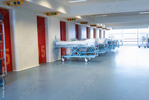Clean hospital beds covered with film, ready for new patients. photo