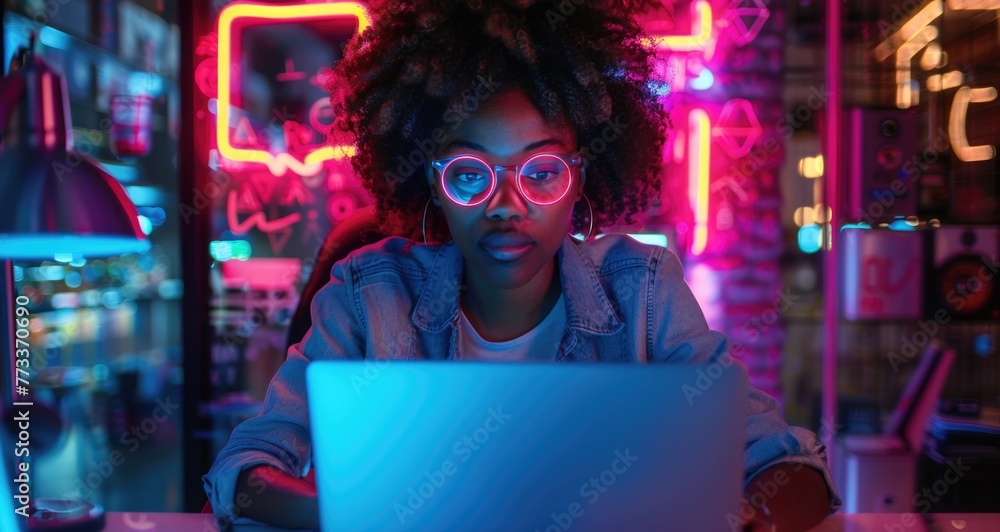 Female Specialist is Writing Business Strategy, Using Digital Tablet to Take Notes in Creative Office Environment. Young Project Manager with Headphones Working on Laptop Compute