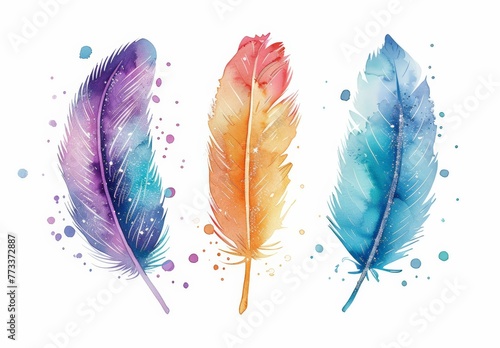 Three watercolor feathers displayed in three distinct colors against a plain background photo