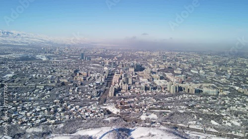 TV tower on Mount Koktobe and the city of Almaty.The old building of the television tower. photo