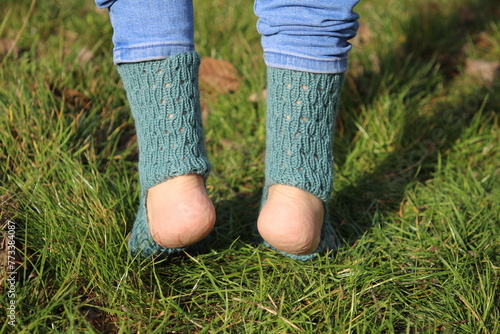 A person's feet in the grass