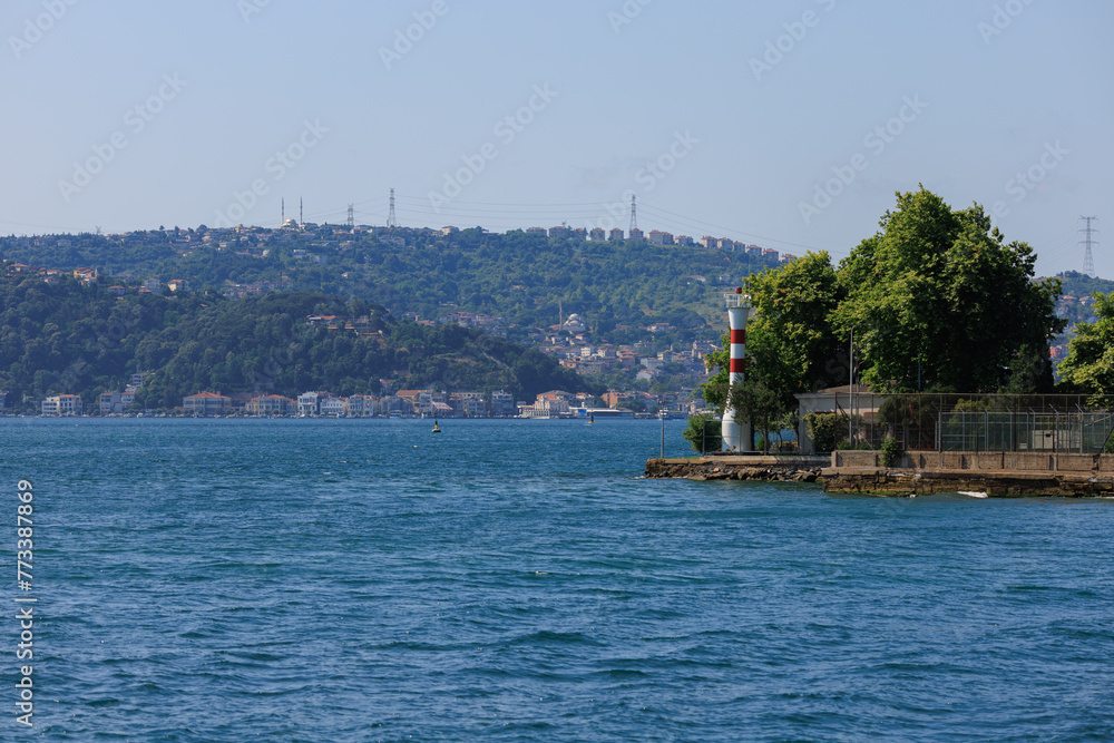Embankment and sea, beach and buildings of a southern city, public place in Turkey, on a summer sunny day Embankment and sea, beach and buildings of a southern city, public place in Turkey, on a summer sunny day