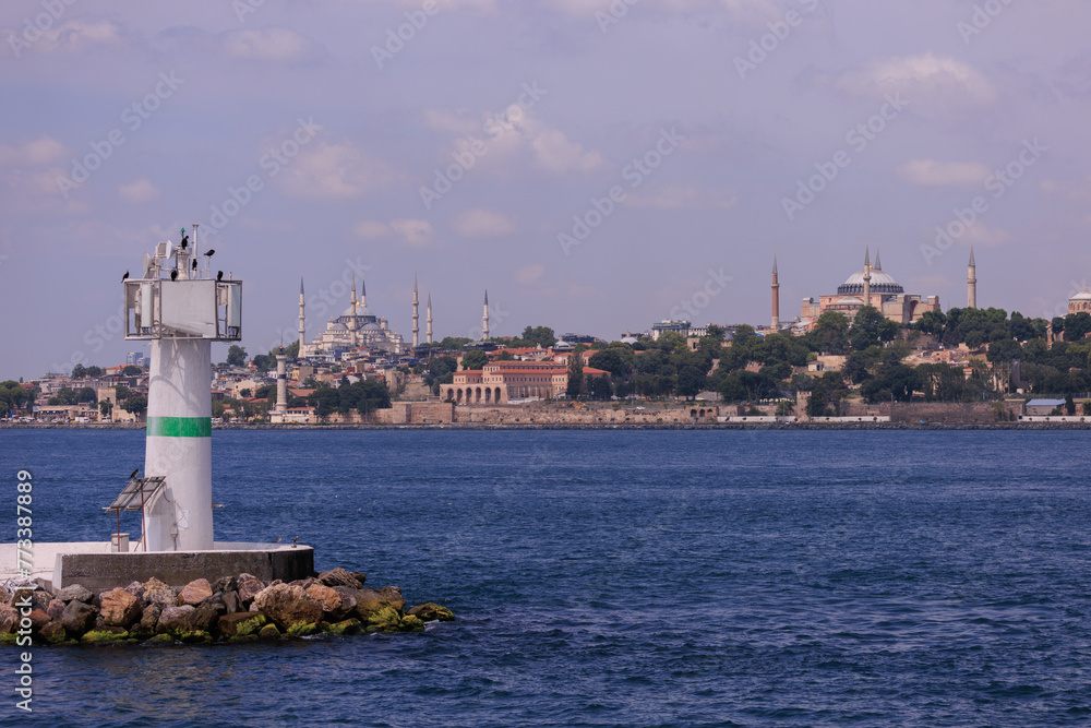 Embankment and sea, beach and buildings of a southern city, public place in Turkey, on a summer sunny day Embankment and sea, beach and buildings of a southern city, public place in Turkey, on a summer sunny day